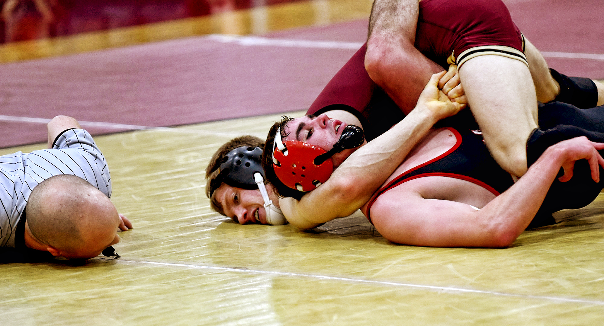 Sophomore Ben Bogart gets his opponent's shoulders on the mat just before the referee taps out to give him the pin during the Cobbers' dual with MSU Moorhead.