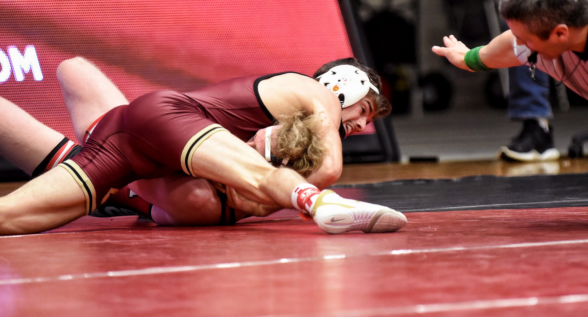 Junior Cole Kubesh gets his opponent's shoulders on the mat in his match at 125. He wound up winning by pin to earn his team-leading 15th win of the year.