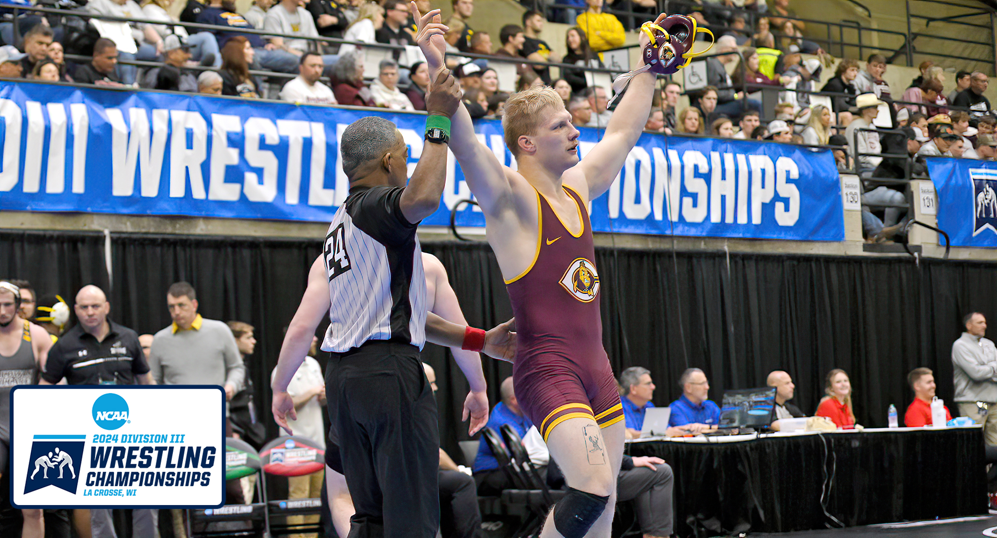 Senior Gabe Zierden gets his hand raised after his 8-2 win in the quarterfinals at the NCAA Meet. That win earned him All-American honors.