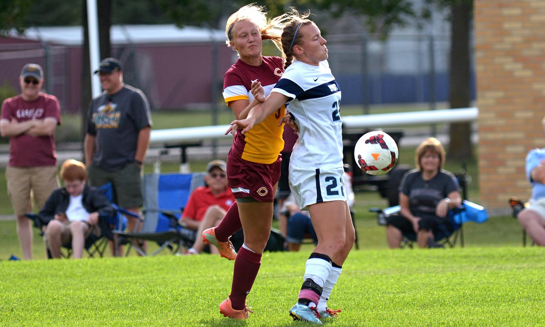Sophomore defender Erin Eidsness defends against a Wis.-Stout attacker during the Cobbers' 0-0 double OT tie in the season opener.