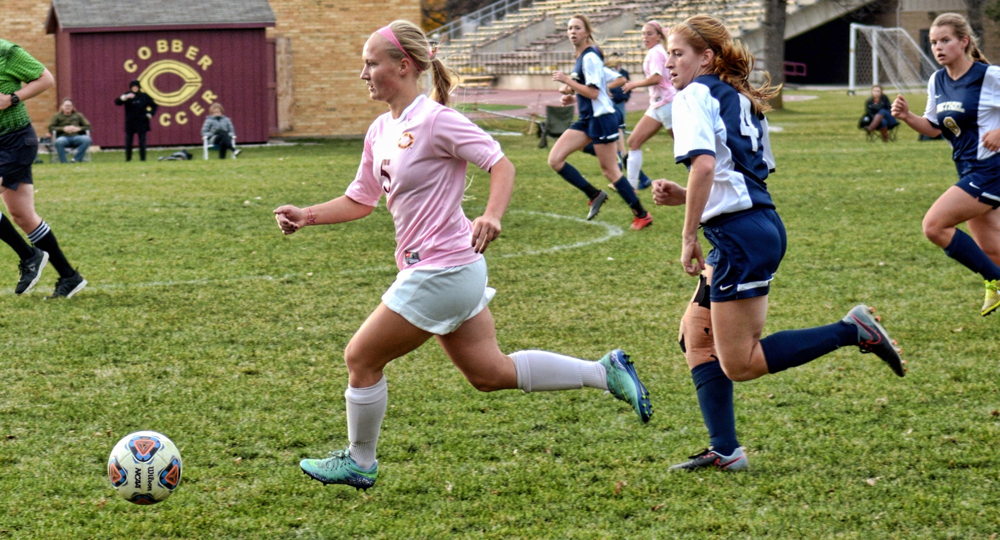 Junior defender Erin Eidsness dribbles the ball up the field during the Cobbers' game with Bethel.