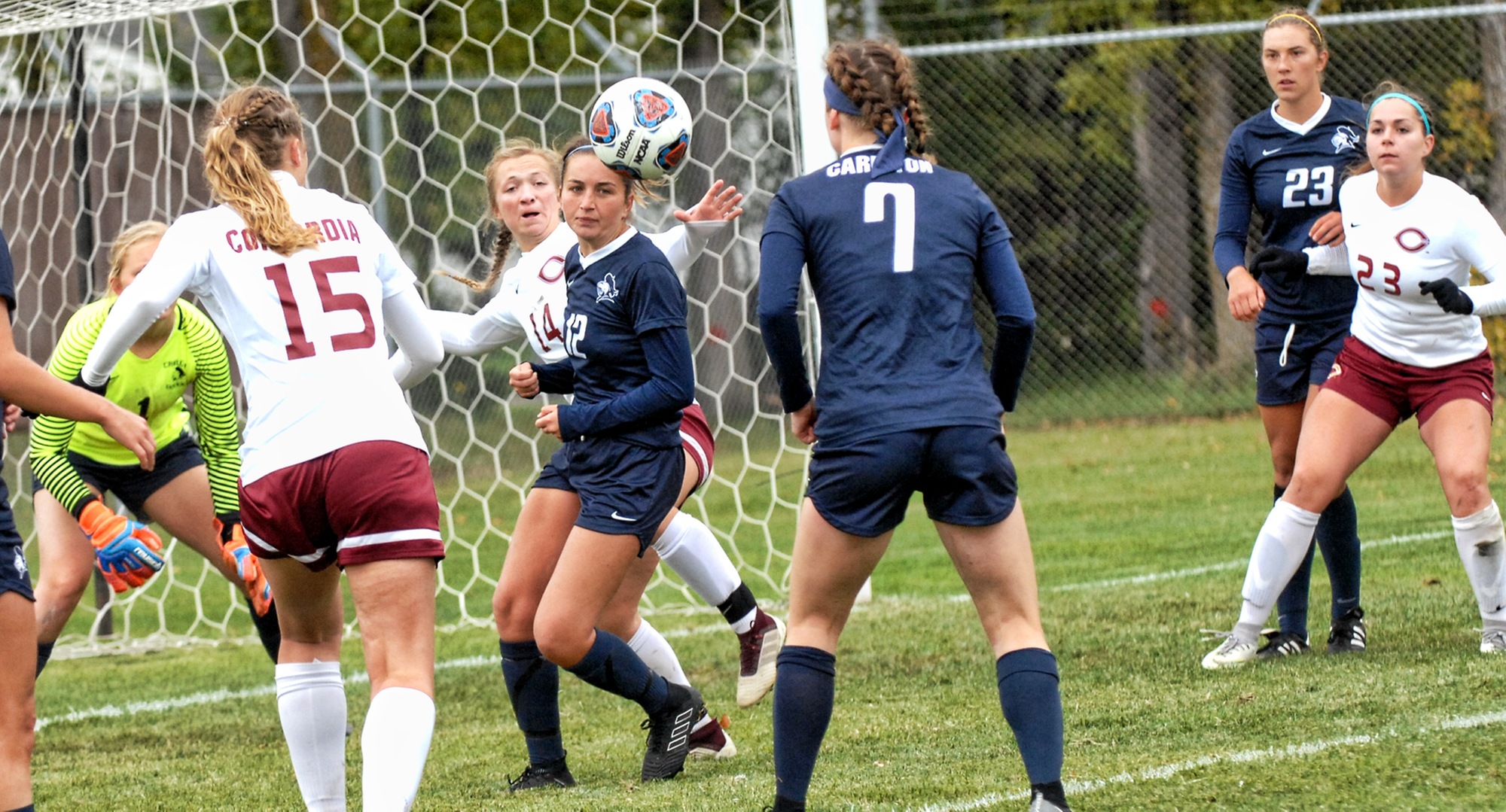 Players follow the ball  near the Carleton goal in the Cobbers' 1-1 2OT tie.