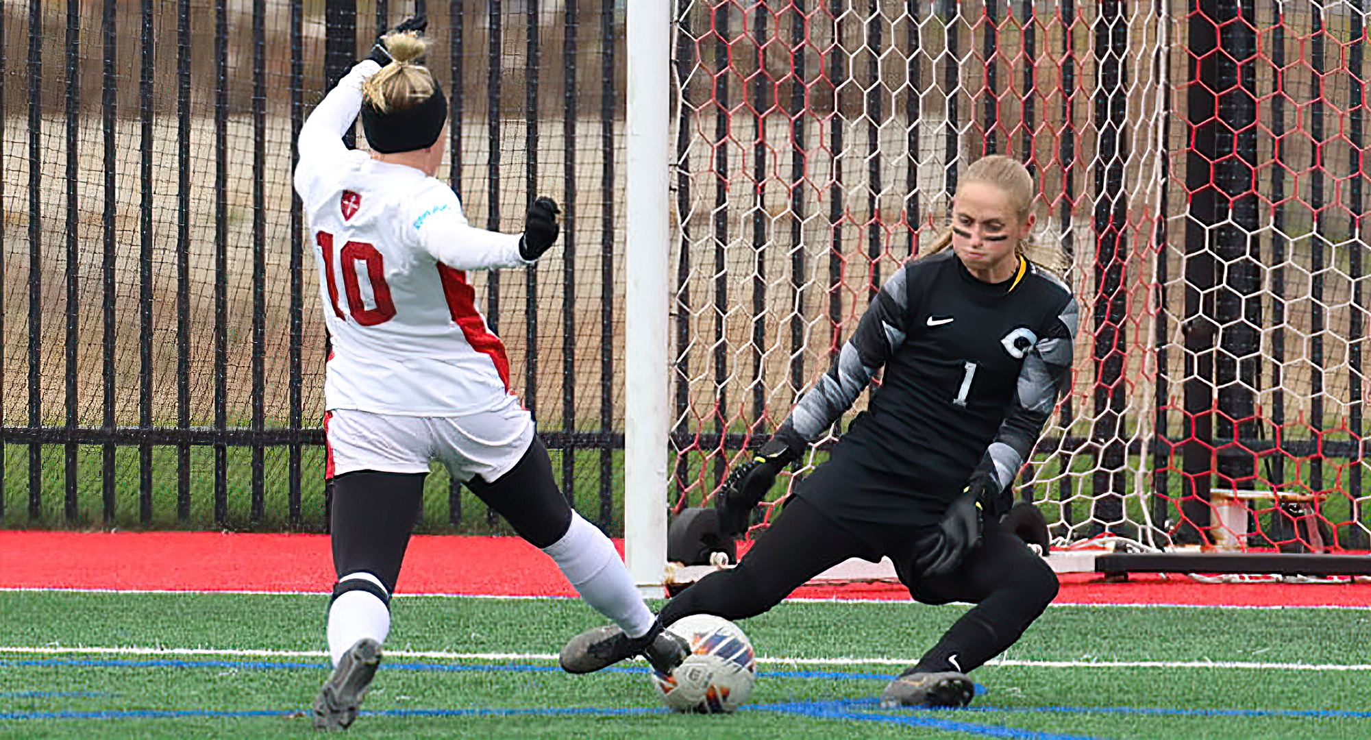 Senior goalie Bre Nelson makes one of her nine saves in the Cobbers' 2-0 win at St. Ben's in the quarterfinals of the MIAC playoffs.