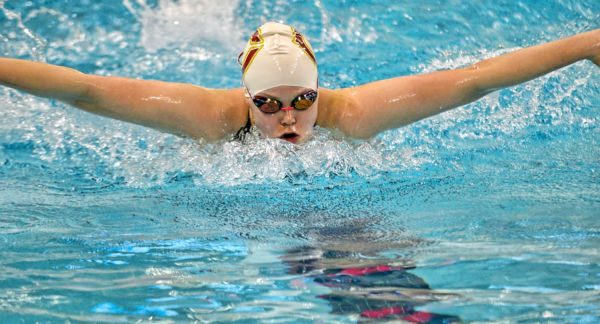 Amy Warren swims the butterfly leg of the 400-yard IM in the B finals at the MIAC Meet. She went on to break her own school record in the event. (Photo courtesy of BJ Pickard - MIAC Office)