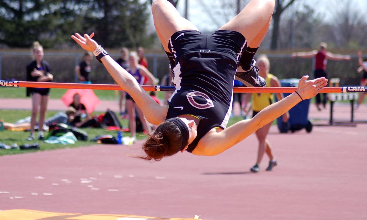Junior Emma Peterson clears the bar in the high jump at the Lee Krough Gustavus Invite. Peterson broke the school record in the even and posted the best mark in Division III this year.