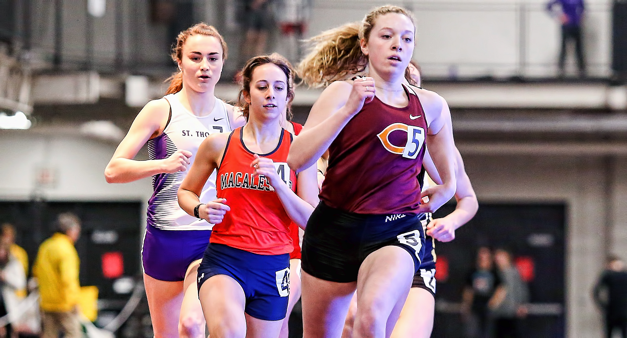 Sophomore Josie Herrmann sprints past a pack of runners during her second-place finish in the 800 meters at the MIAC Indoor Meet. (Photo courtesy of Nathan Lodermeier)