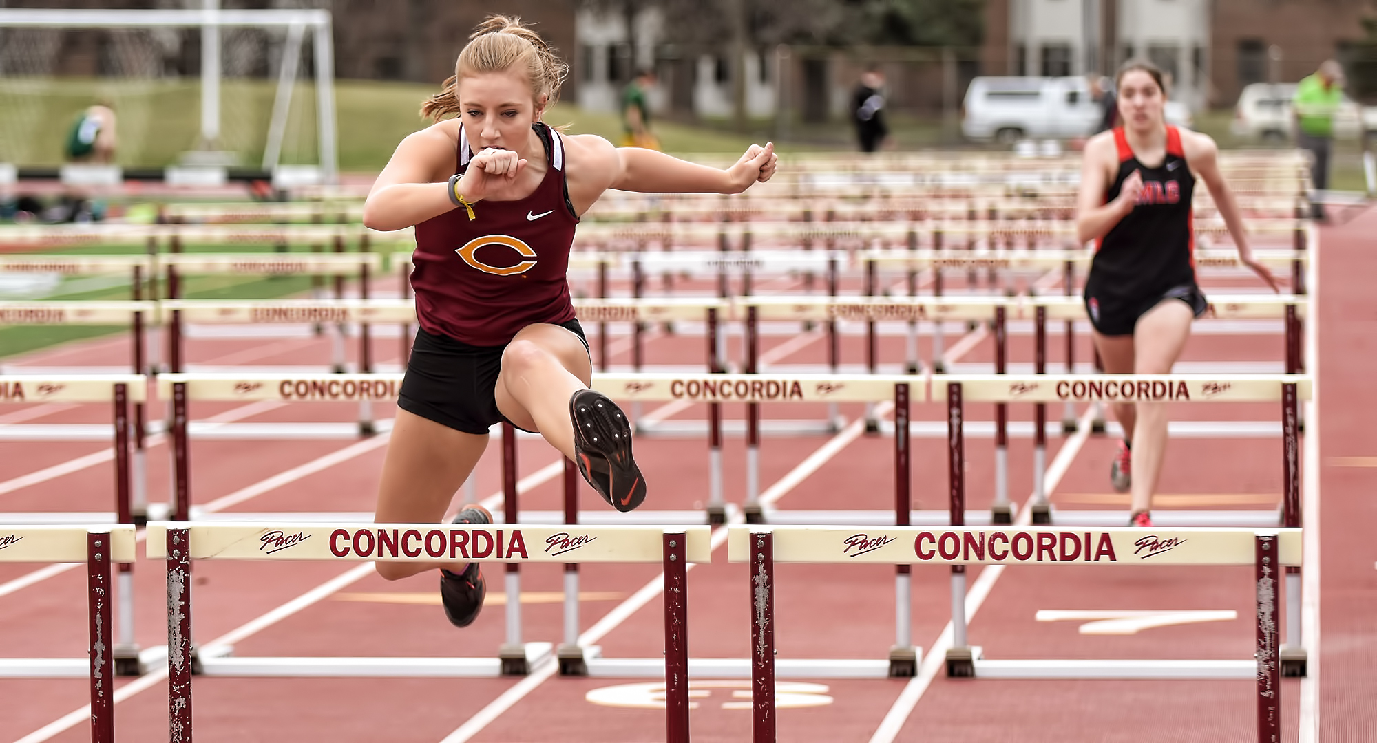 Senior Jenna Stilwell finishes strong in the 100-meter hurdles in the Cobber Twilight Meet. She recorded Top 10 finishes in both the hurdles and javelin.