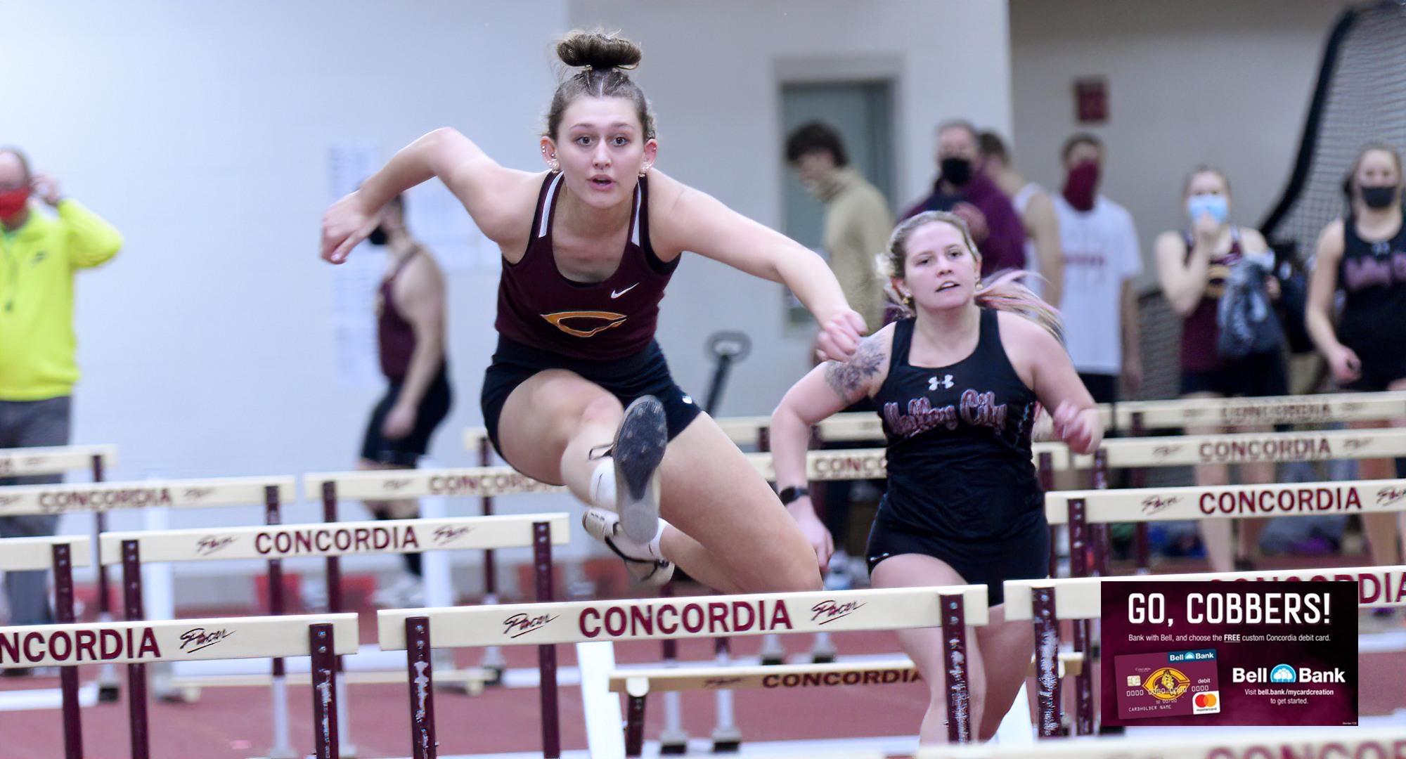 Freshman Peyton Selle clears a hurdle during the 60-meter hurdles in the home-opening Cobber duals meet. She went on to win the high jump.