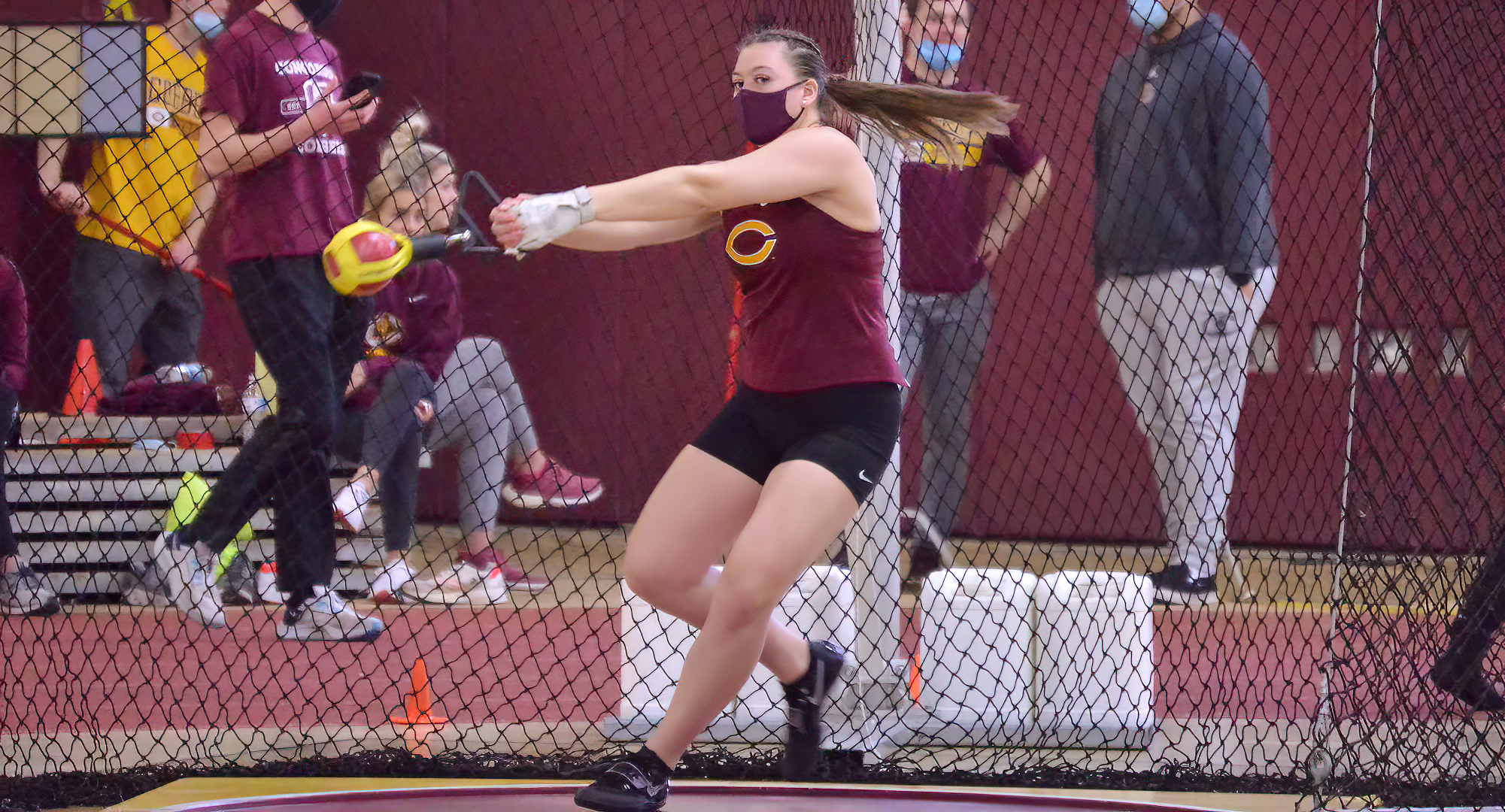 Senior Cayle Hovland gets ready to release the weight throw at the Cobber Open. She won both the weight throw and the shot put at the meet.