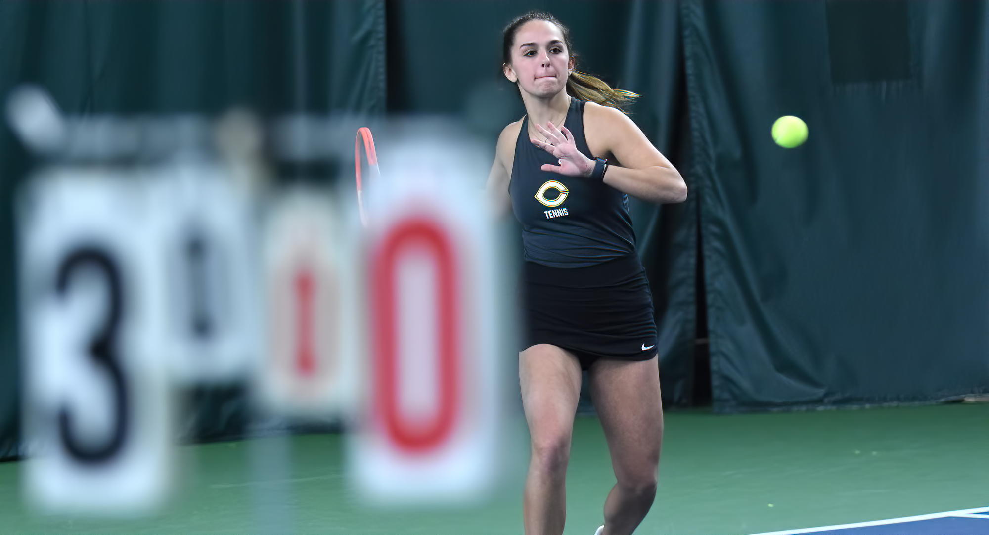 Freshman Julia Wolf goes for the forehand winner in her match at No.6 singles. She won 6-4, 7-5 and is now 2-1 in singles play this year.