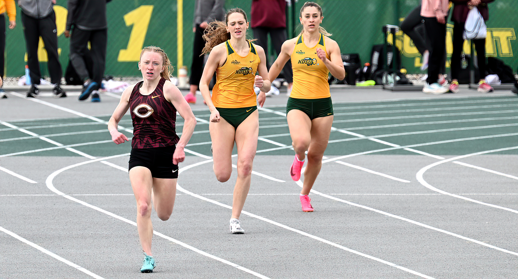 Maddie Guler comes out of the turn and heads for home in the 400 meters at the NDSU Tune-Up Meet. She won her heat with a time of 1:02.07.