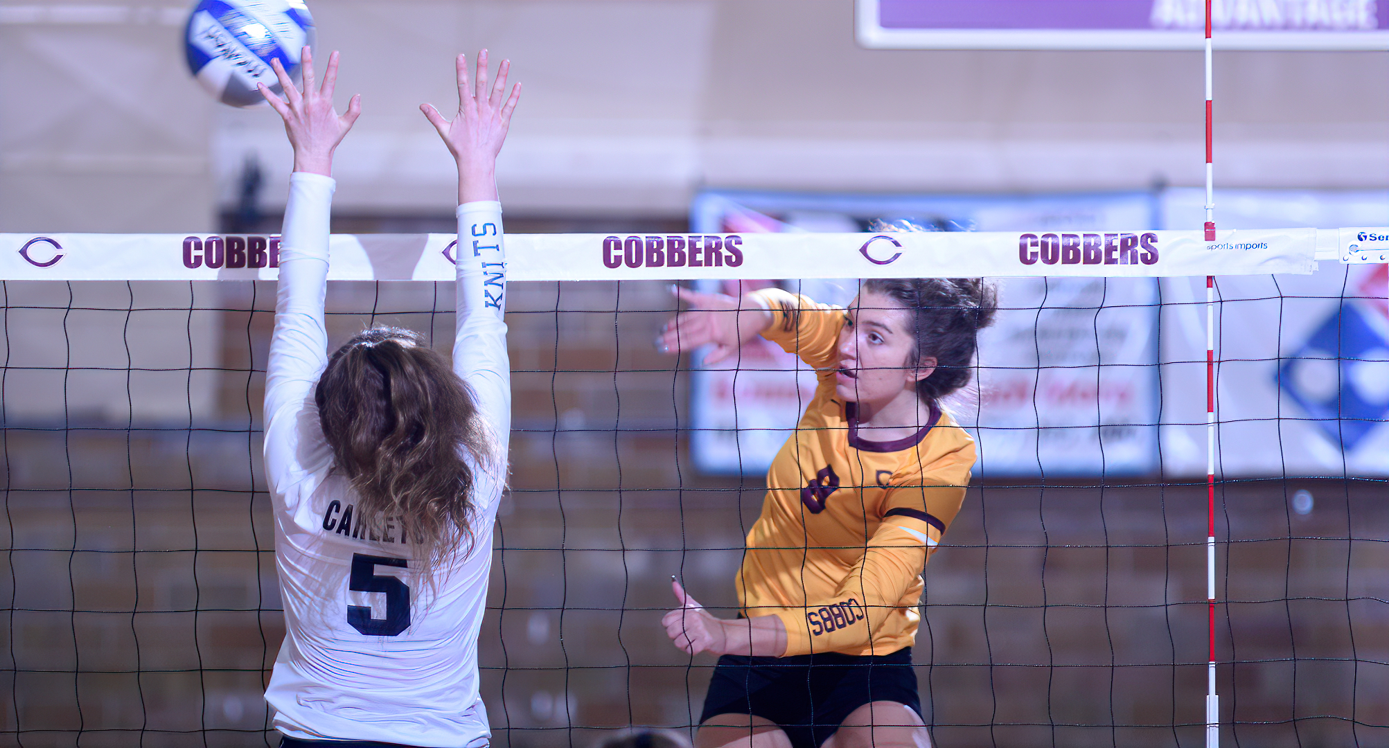 Junior Brook Carney goes cross court for the winner in the Cobbers' match with Carleton. She finished with 9 kills and a career-high 5 blocks.