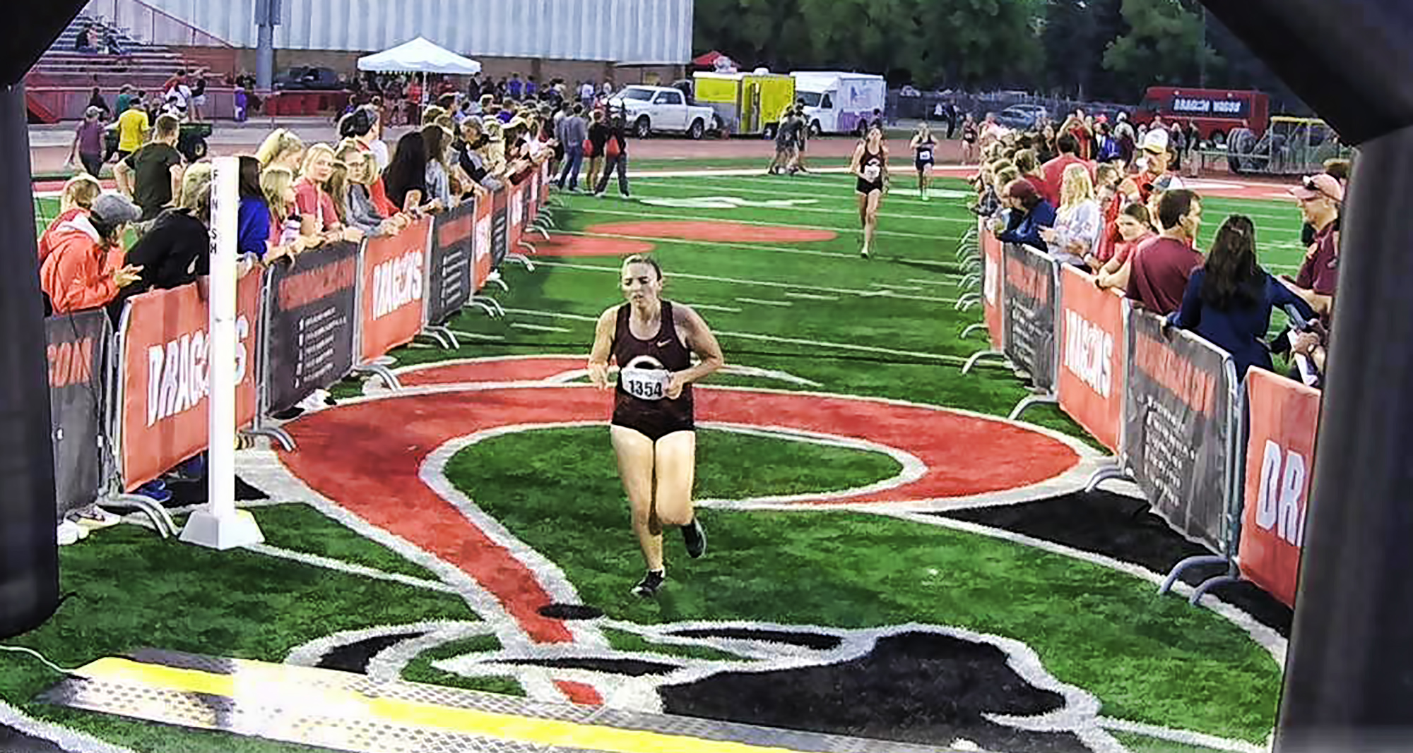 First-year athlete Grace Ingebretsen crosses the line at the MSU Moorhead Twilight Meet. She led the Cobbers with a time of 16:03.8.