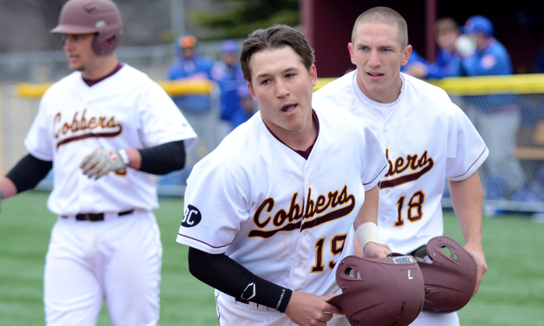 Cody Rahman receives congratulations after hitting a two-run homer in the first game of the Cobbers' sweep of Macalester.
