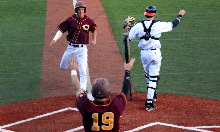 Devin Johnson comes home to score a run in the fifth inning of the Cobbers' 9-8 11-inning win over St. John's in the MIAC playoffs.