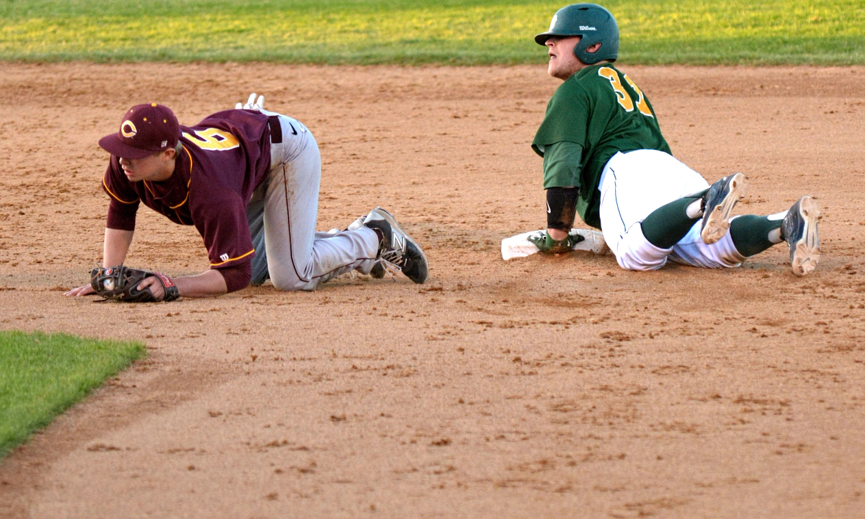 Cobber second baseman Grant Toivonen dives to try and apply a tag to an NDSU base runner during Concordia's game with the Division I Bison.