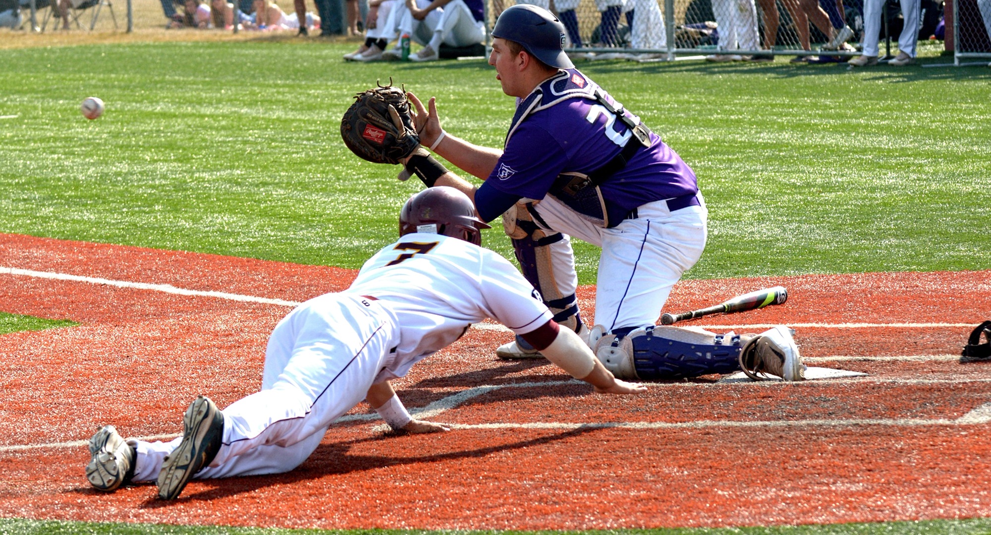 Sophomore Alec Sames slides safely into hom in the second game of the Cobbers' DH with St. Thomas. Hoeft was 3-for-3 in the game.