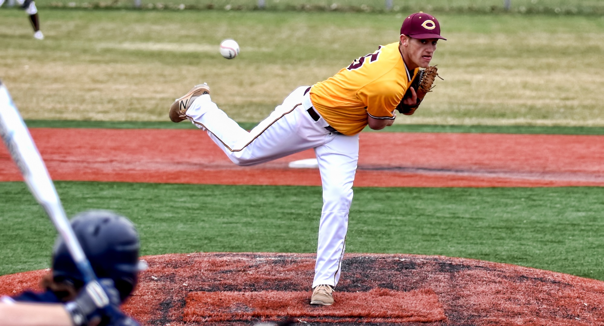 Freshman Sean McGuire delivers a pitch to home during the Cobbers' second game with Bethel. He pitched two scoreless innings.