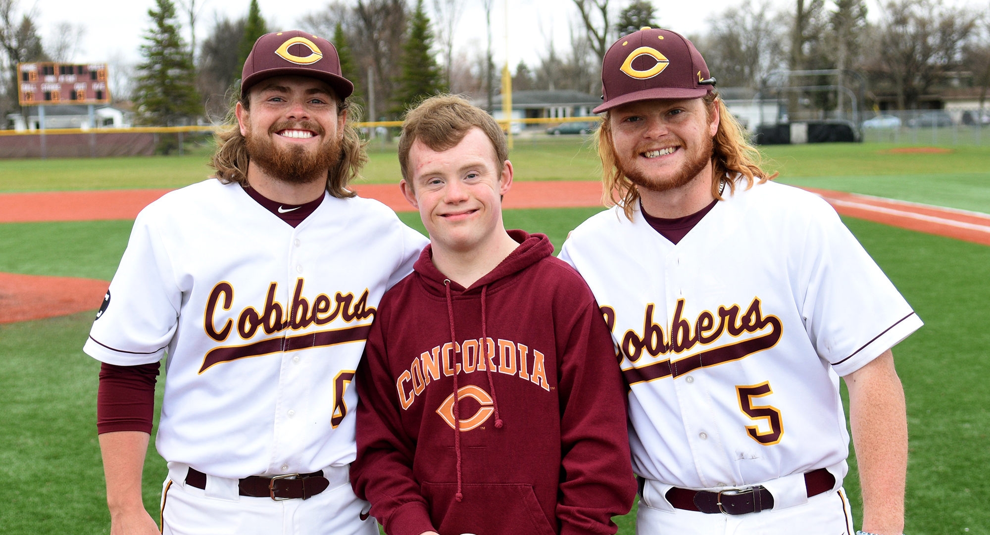 Cobber seniors (L-R)  Dawson Leer, Jack Naugle, Sam Beedy and their parents were honored before Concordia's MIAC win over Gustavus.