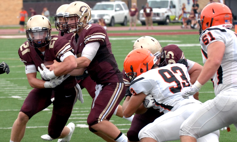 Alex Grove hands off to Chad Johnson for the first score of the game in the Cobbers' 41-17 win over Jamestown.