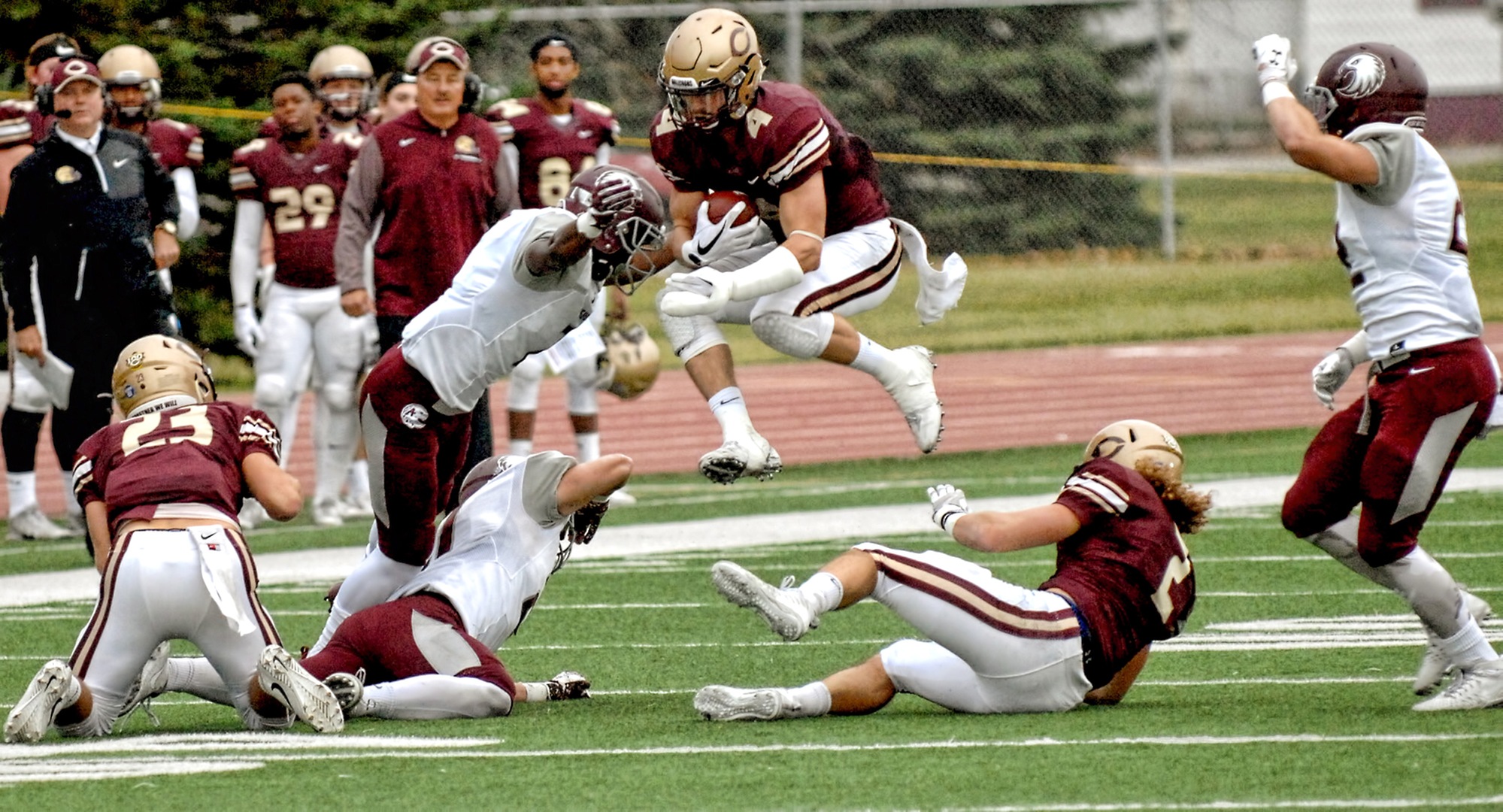 Senior Jason Montoyne flies through the air during one of his nine carries in the Cobbers' 42-20 win over Augsburg.