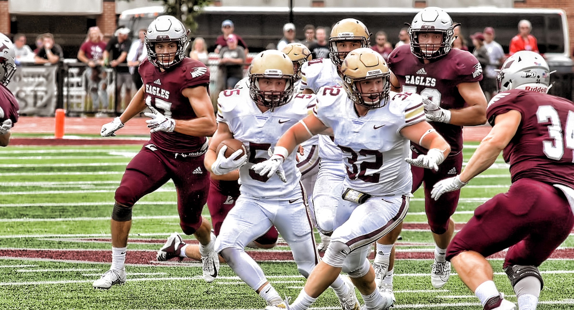 Sophomore Andy Gravdahl weaves his way through the La Crosse defense. He scored one of the two Cobber TDs on the day. (Photo courtesy of Vince Arnold)