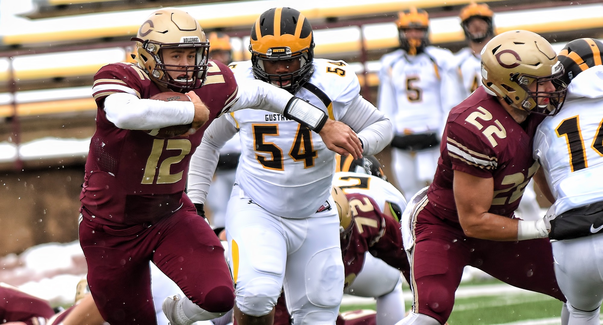 Senior quarterback Blake Kragnes runs through the defensive line of Gustavus during the Cobbers' Homecoming game. Kragnes scored all four of CC's touchdowns.