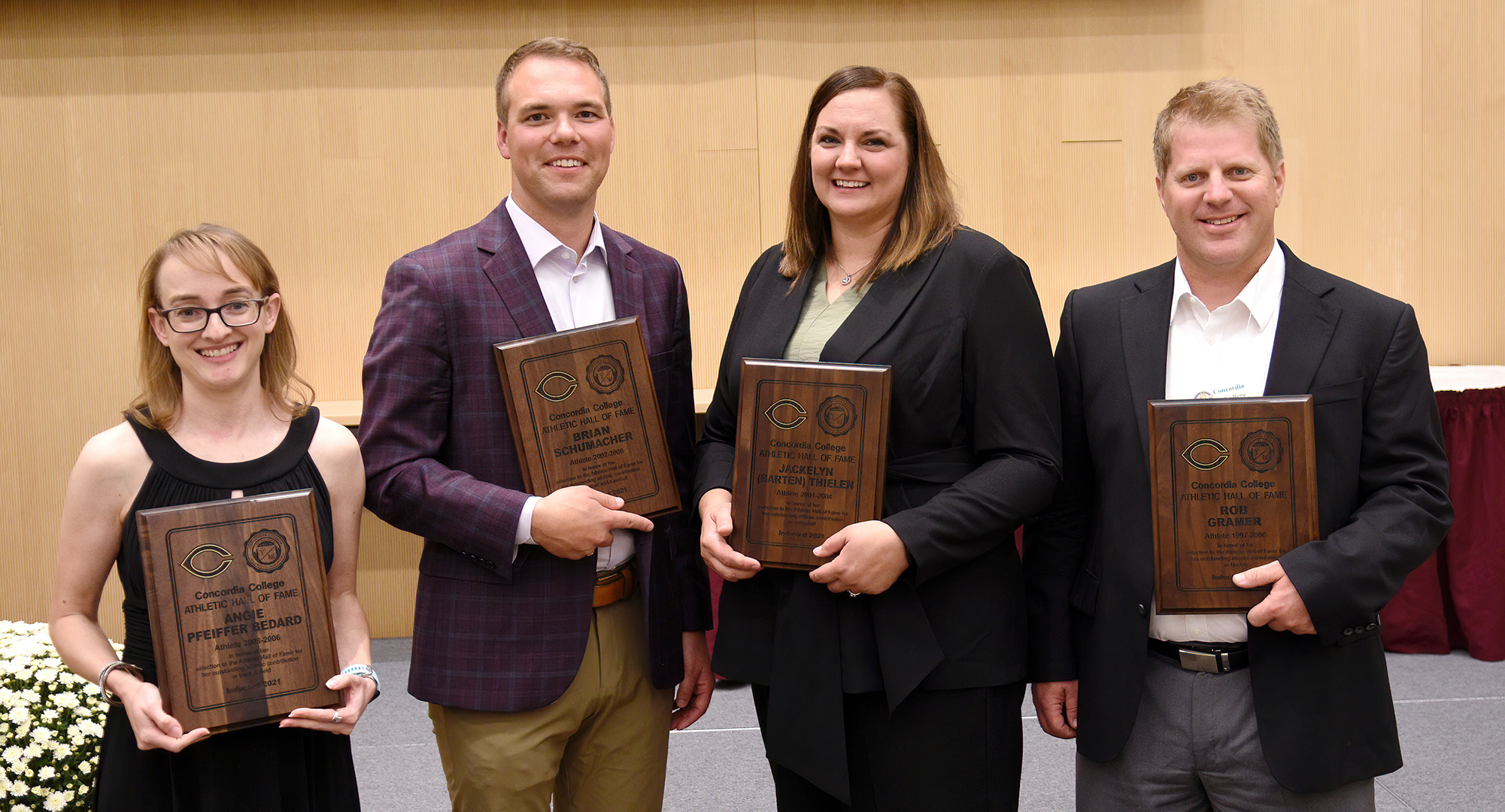 Former Concordia standout athletes (L-R) 6-time Track & Field All-American Angie Pfeiffer Bedard, 2-time football MIAC MVP Brian Schumacher, 2-time volleyball All-American Jacki (Barten) Thielen & hockey All-American Rob Gramer were inducted into the Hall of Fame on Saturday.