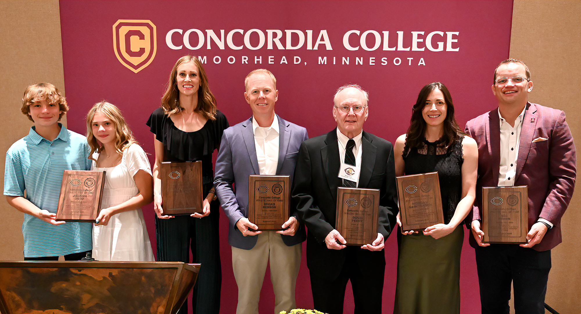 (L-R) Josh Dietz '05 (family), Rebecca (Shane) Jorgenson '07, Micah Benson '00, Doug Perry '65, Morgan Bain Hirsch '07 and Nic Didier '05  were inducted into the Hall of Fame.