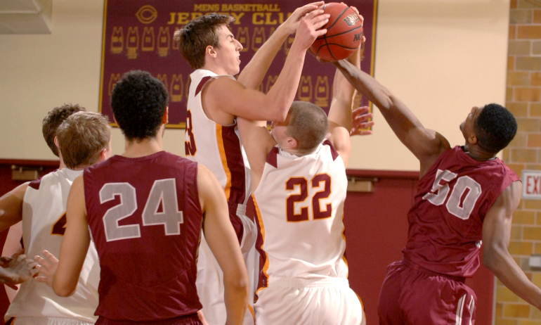 Jordan Bolger goes above the crowd to rip down one of his game-high eight rebounds in the Cobbers' win over Hamline.
