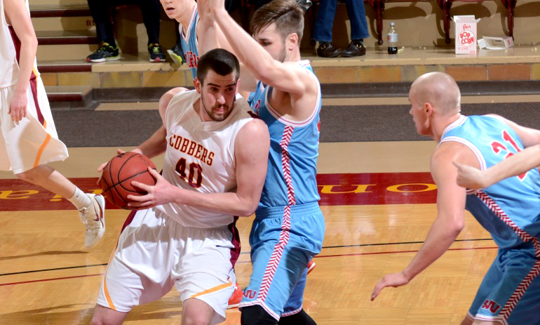 Senior Scott Flotterud drops his shoulder and drives to the basket for two of his six points in the Cobbers' game with St. John's.