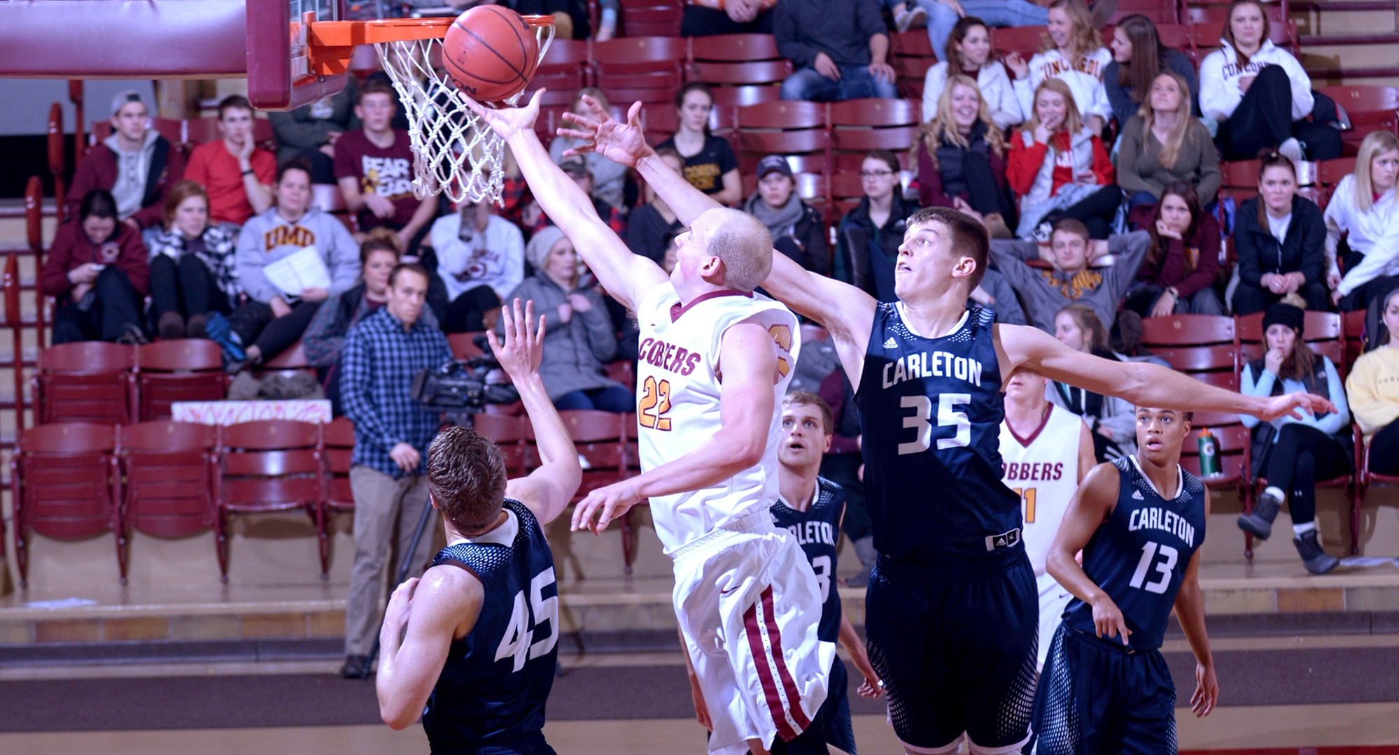 Junior Dawson Peterson drives to the basket to lay in two of the Cobbers' 63 points in CC's eight-point win over Carleton.