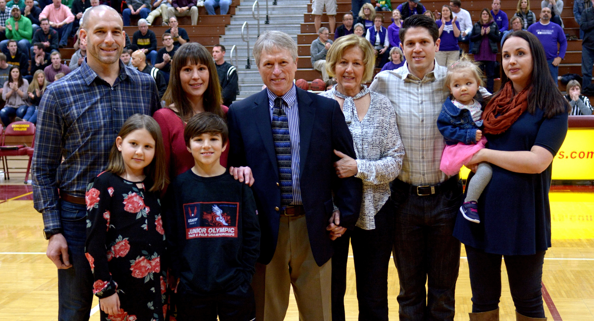 Concordia head coach Rich Glas is surrounded by his wife, kids and grandkids before the final game of his legendary 37-year career.