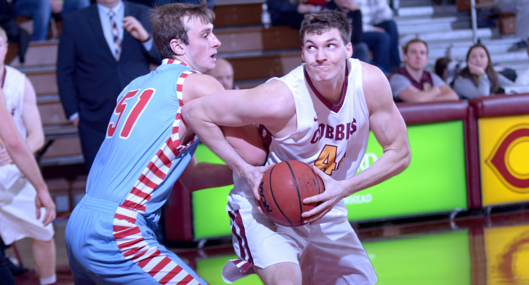 Senior Kevin Wolfe tries to break free from a St. John's defender during the Cobbers' first MIAC game of 2018. Wolfe went 7-for-11 from the floor and finished with a team-high 17 points.
