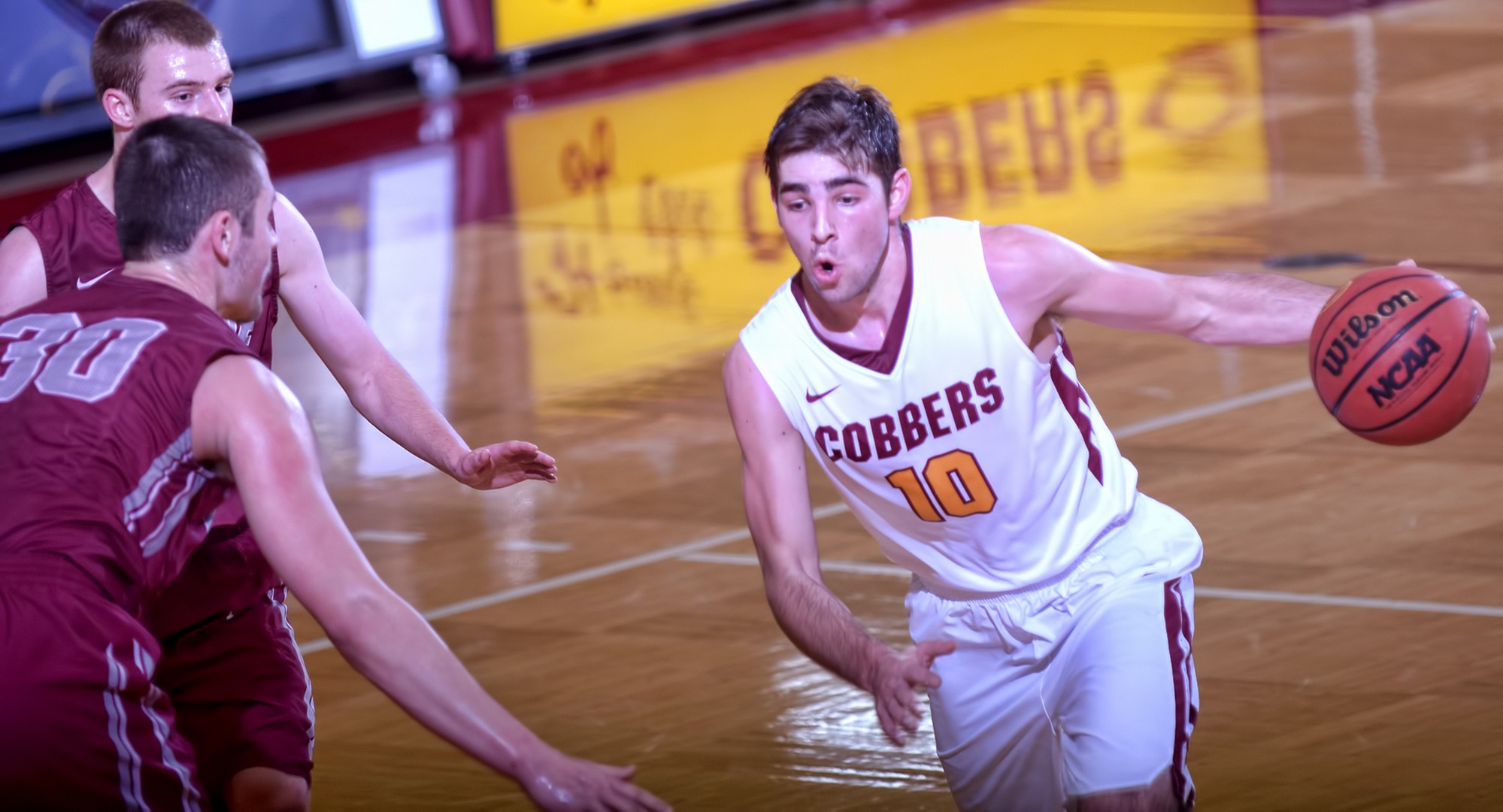 Sophomore Tommy Schyma dribbles to the basket for two of his team-high 16 points against Hamline. Schyma also had 11 rebounds and six assists.