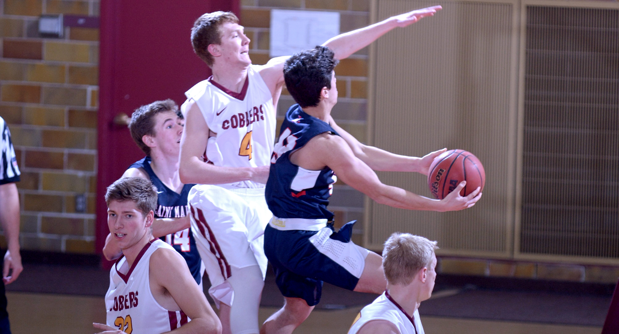 Collin Larson (#4) led Concordia with 11 points and four rebounds in the Cobbers' game at Carleton.