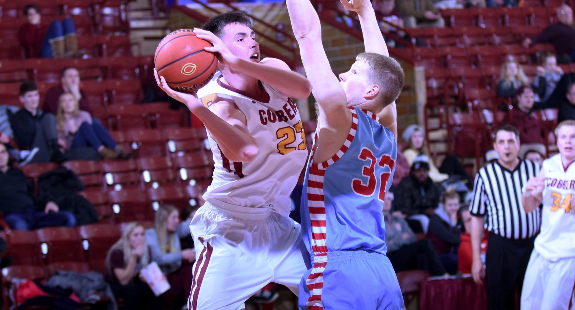 Senior Jordan Davis drives around a St. John's player and looks to make a pass during the first half of the Cobbers' game with the Johnnies.