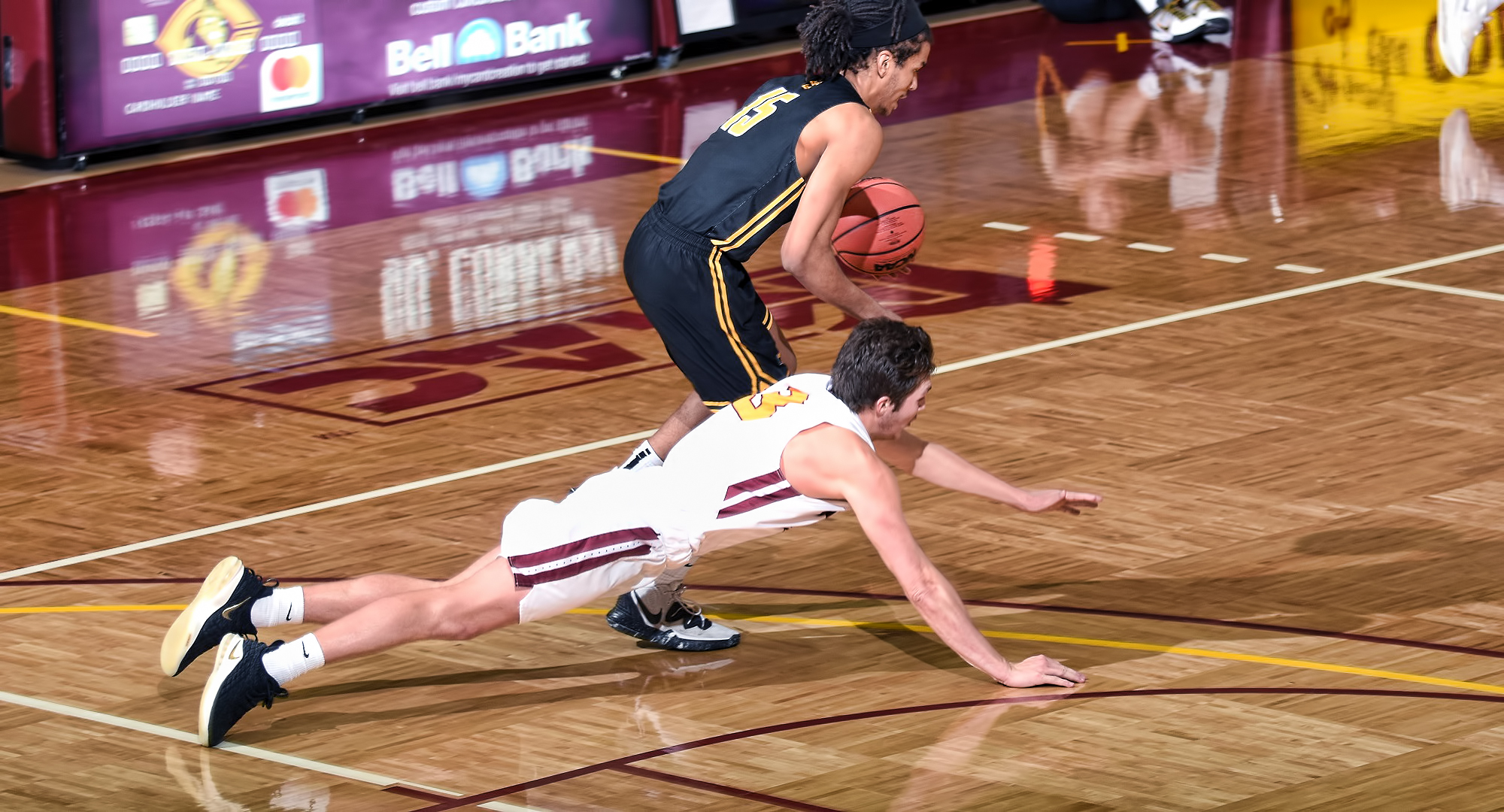 Freshman Braeton Motschenbacher dives after a loose ball in the second half of the Cobbers' game with Gustavus. He finished with a game-high eight rebounds.