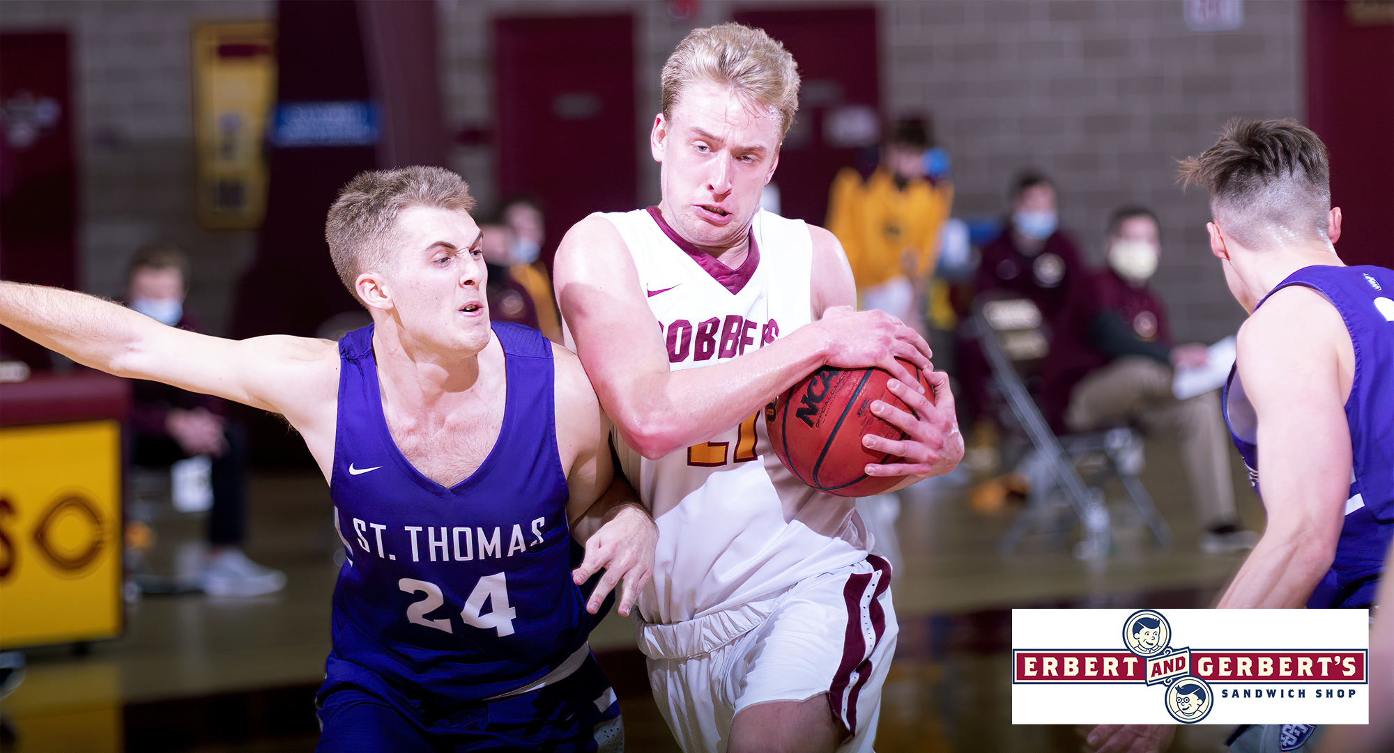 Junior David Birkeland gets tied up on a drive to the basket in the first half of the Cobbers' season opener against St. Thomas. Birkeland led CC with a career-high 19 points.