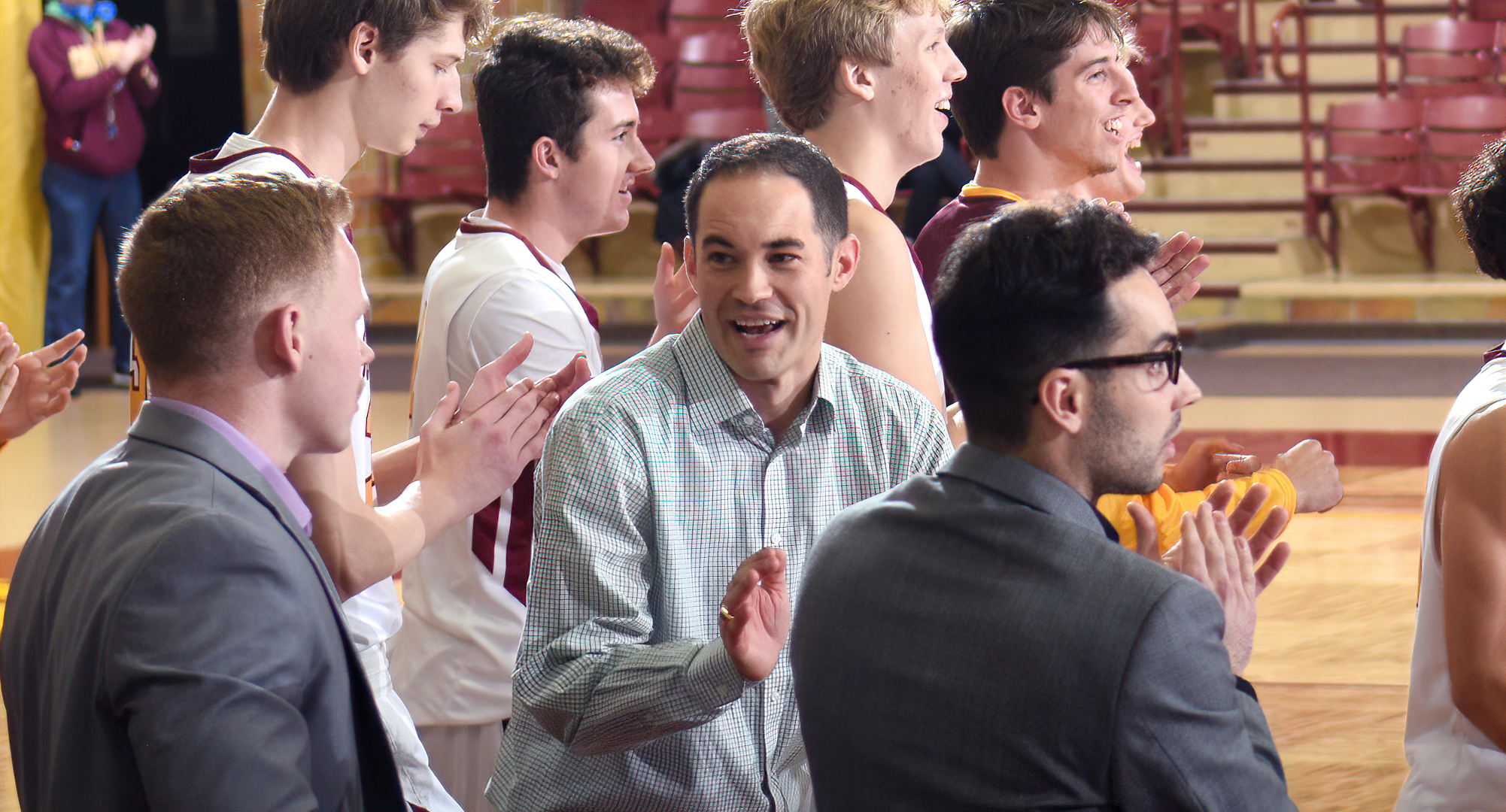 Cobber head coach Tyler Bormann is all smiles as the buzzer sounds in Concordia's win over Martin Luther.  It was his first collegiate victory.