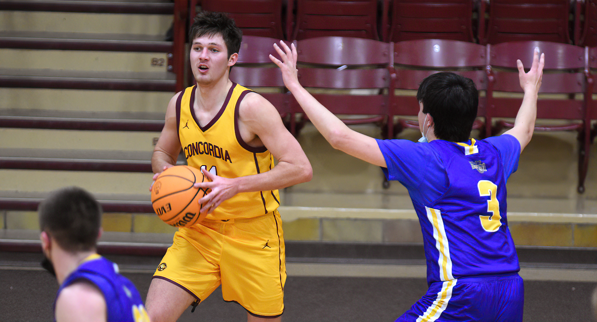Braeton Motschenbacher looks to make a pass during the first half of the Cobbers' win over St. Scholastica. He led CC with 18 points and eight boards.
