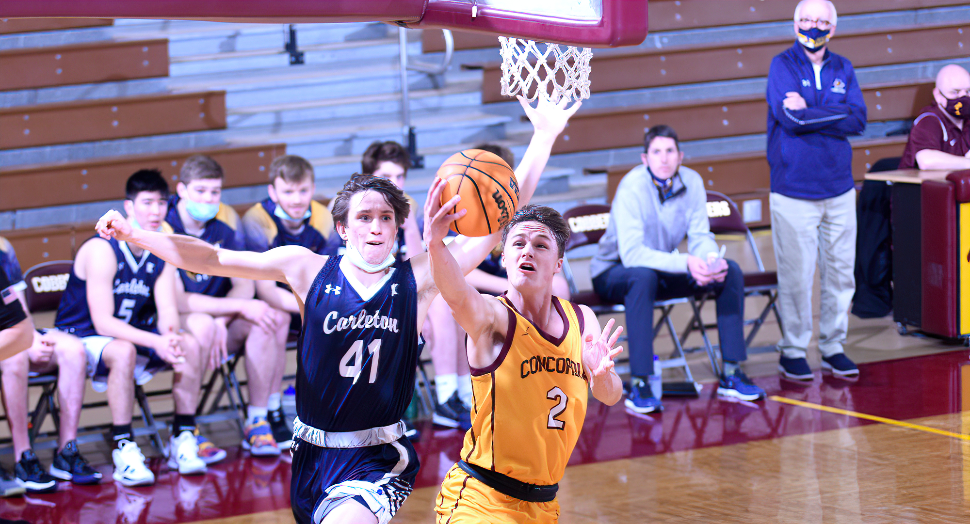 Jackson Jangula scores on the reverse layup during the first half of the Cobbers' game with Carleton. He also went 4-for-5 from 3-point range,