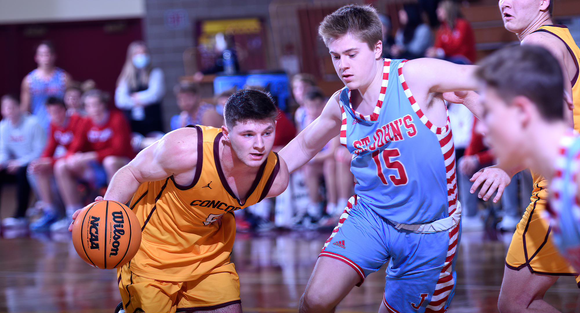 Junior Talon Hoffer drives to the basket during the Cobbers' game with St. John's. Hoffer went 4-for-5 from the floor and finished with 13 points.