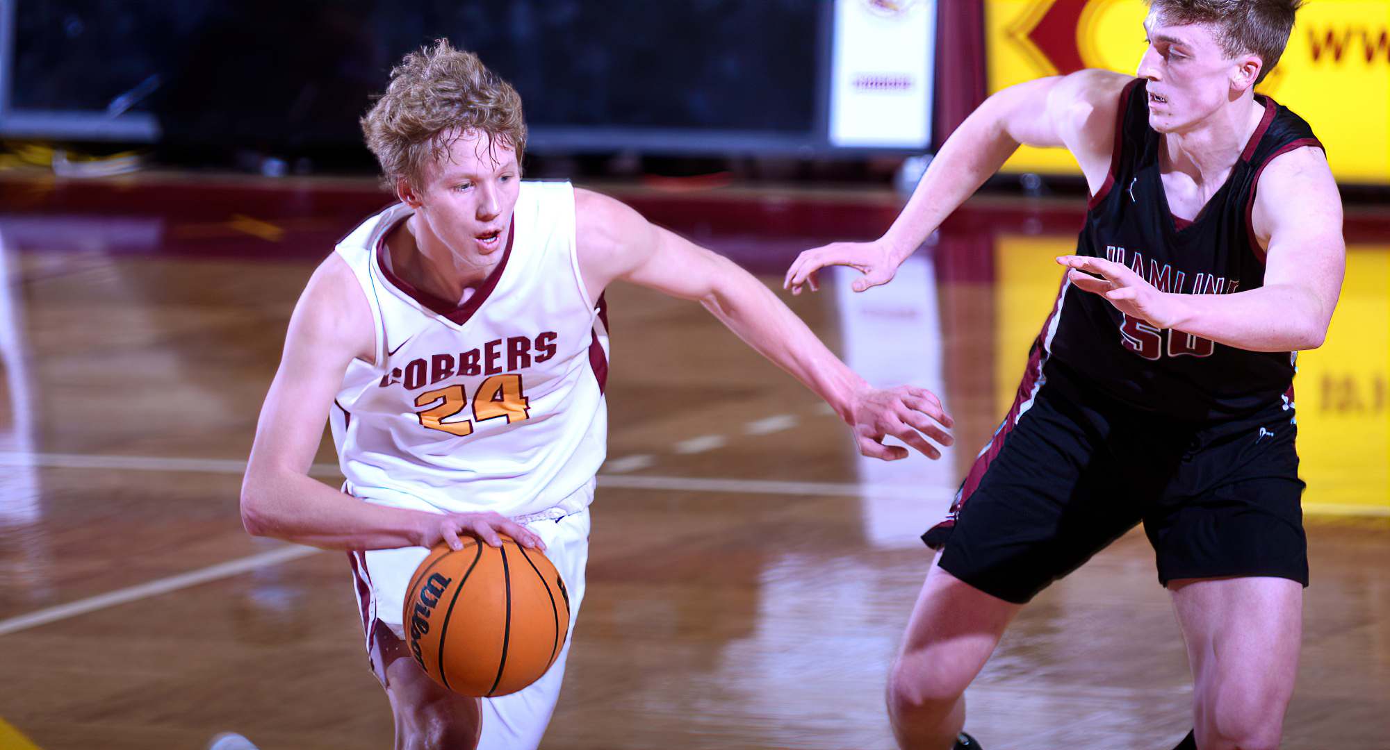 Freshman Dylan Inniger dribbles past a Hamline defender in the Cobbers' game against the Pipers. He finished with 14 points.