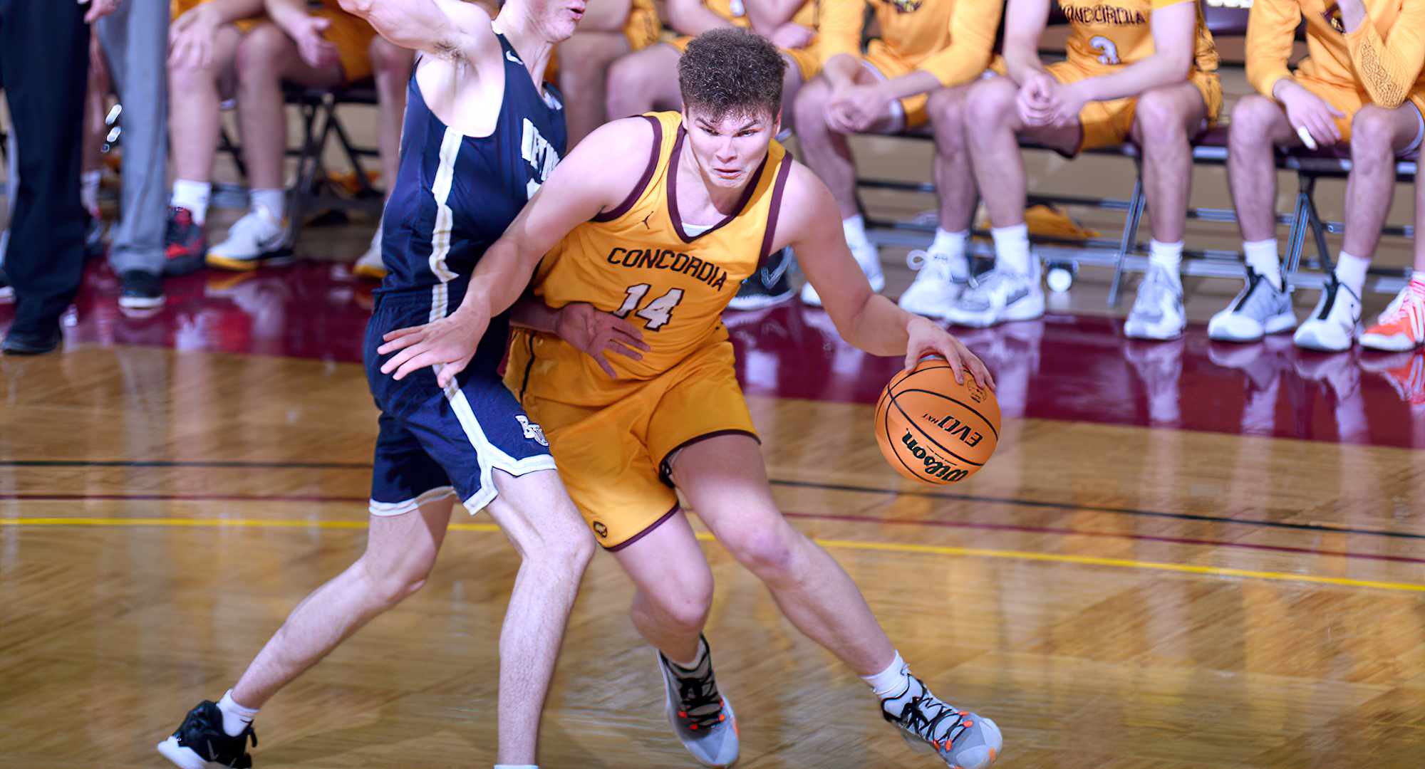 Freshman Rowan Nelson drives the baseline in the second half on his way to two of his 20 points in the Cobbers' game with Bethel