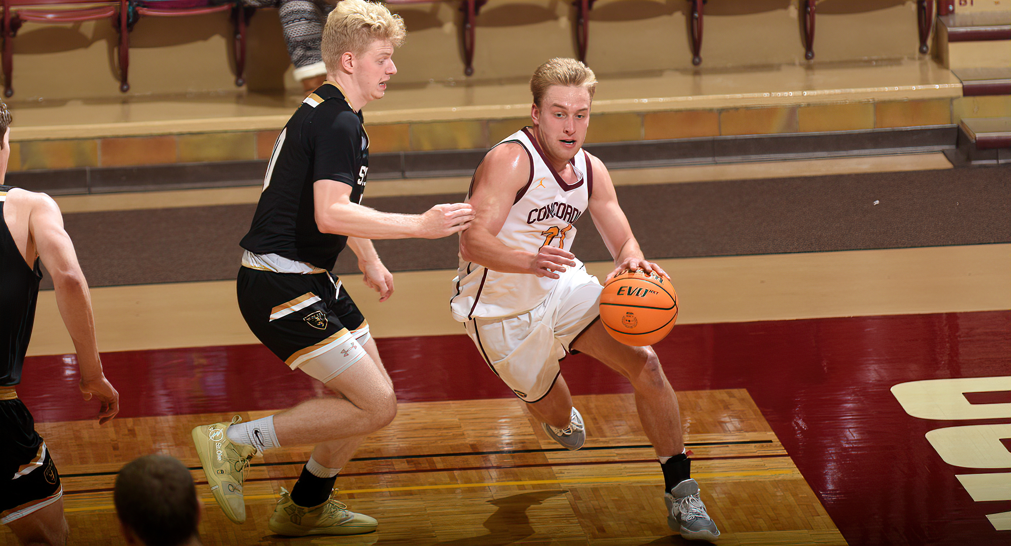 Senior David Birkeland drives to the basket for two of his season-high 14 points in the Cobbers' wire-to-wire win over previously unbeaten St. Olaf.
