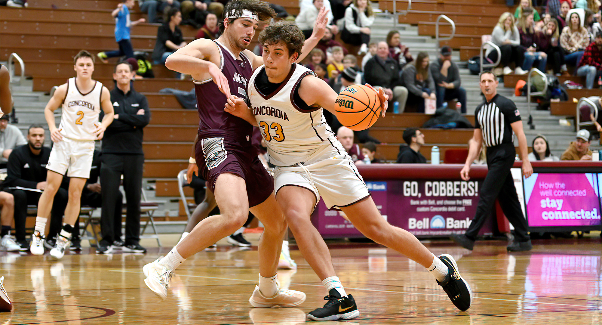 Jacob Cook drives to the hoop for two of his season-high 22 points in the Cobbers' win over Augsburg.