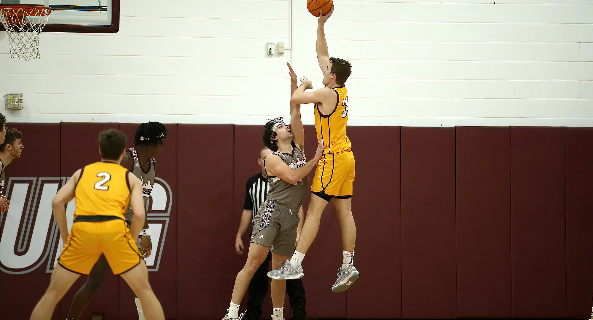 Jackson Loge rises high above the Augsburg to score two of his 15 points in the Cobbers' win. (Photo courtesy of Ryan Coleman, D3photography)