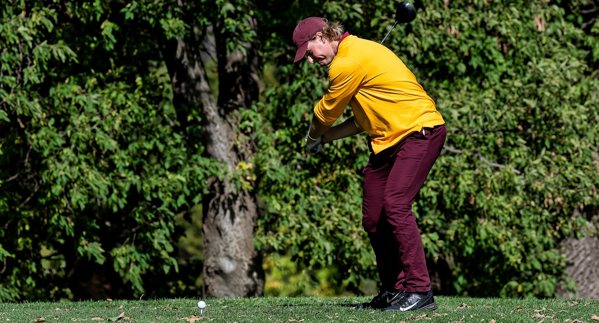 Senior Gage Stromme tees off during the first round at the MIAC Championship Meet. He is tied for the lead after 18 holes of play.