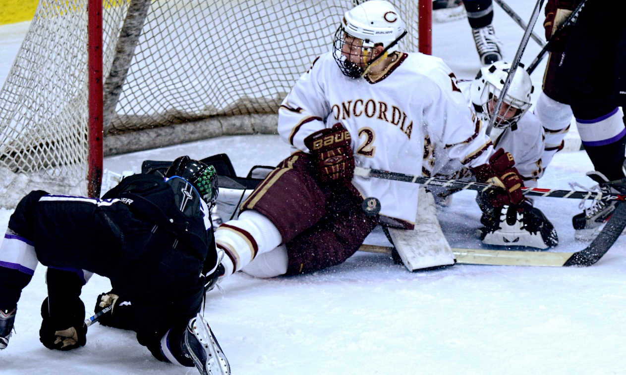 Junior Jordan Krebsbach slides over to block a shot during the second period of the Cobbers' series-opening game with St. Thomas.